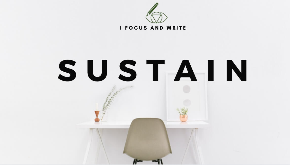Desk inviting to focus and write with the word Sustain, for a more sustainable academic life